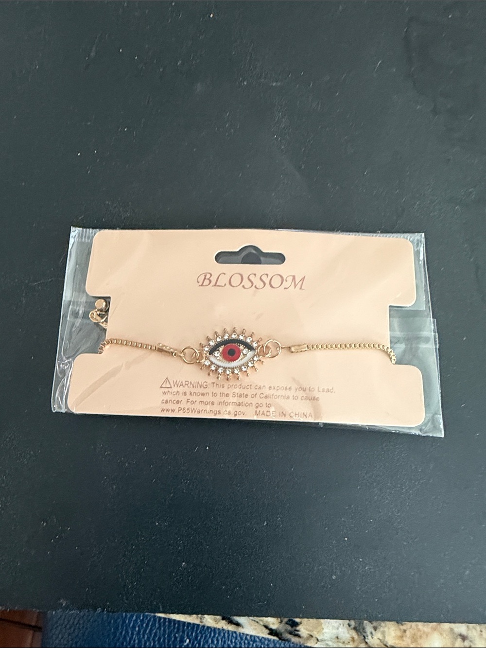 NWOT Blossom Gold Evil Eye Bracelet with Red Accent